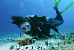 Christina gets up close to a hermit crab. Cozumel. Canon ... by Paul Holota 